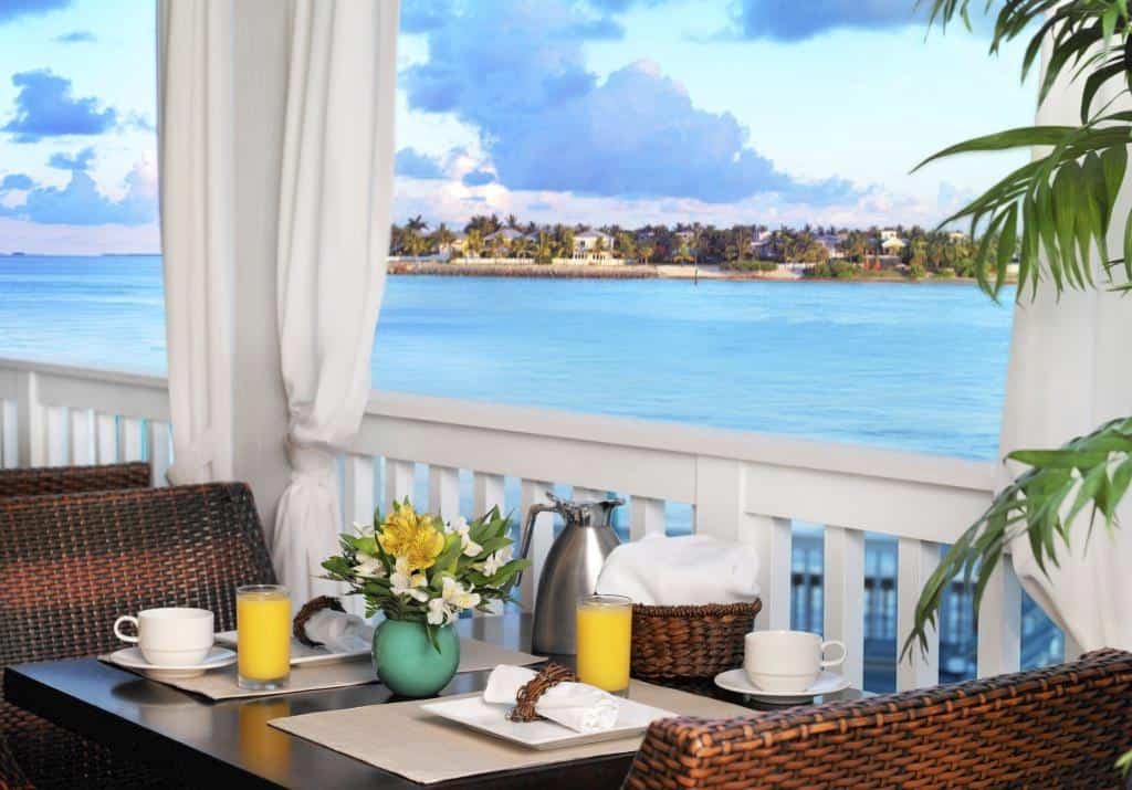 Hot Tin Roof brunch setup overlooking turquoise waters and distant Key West shoreline, ideal for boat rentals, sandbar charters, and tours